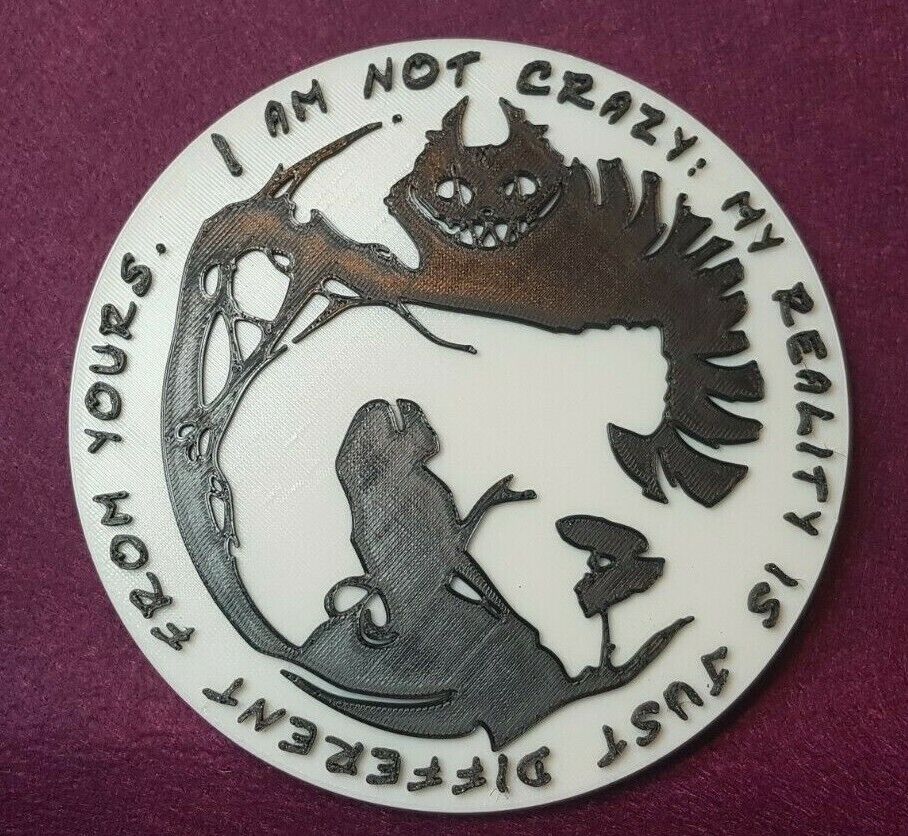 Alice meets the Cheshire cat. Silhouette wall plaque. 150mm diameter.