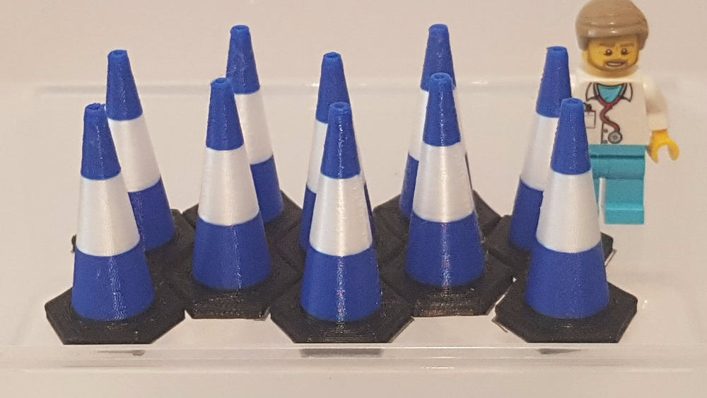 Set of blue and white traffic cones with a LEGO figure in the background